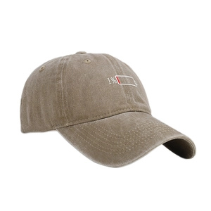 Vintage washed cotton baseball cap featuring low battery 1% embroidery on a curved brim
