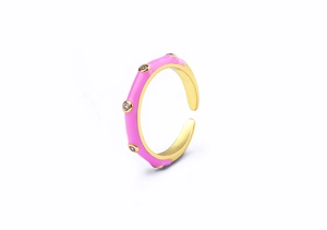 Detailed view of pink enamel 18K gold plated ring with white cubic zirconia accents