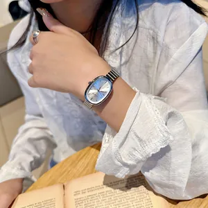 Elegant silver oval women's watch with metal chain strap and minimalist dial display