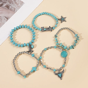 Detail of 5-piece turquoise beaded bracelet set with silver Western charms and Howdy pendant