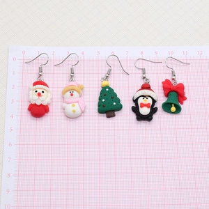 Cartoon Christmas resin earrings set featuring Santa and snowman with measurement grid