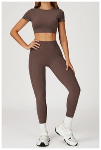 Detail of high-waist mocha yoga pants with seamless compression and body-sculpting lines