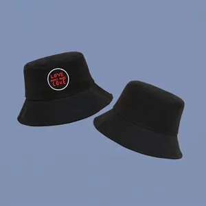 Classic black cotton bucket hat with LOVE embroidery on a blue background