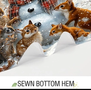 Detail of the sewn bottom hem on a Christmas floral shower curtain with squirrel print