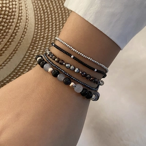 Bohemian style stackable beaded bracelet set in black and silver for women