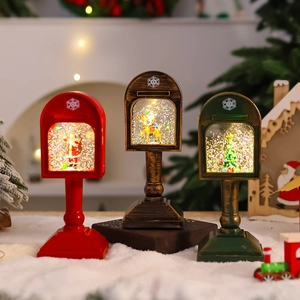 Macro detail of Christmas mailbox snow globe lantern with LED light and swirling glitter