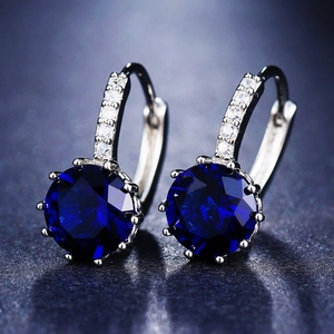 Elegant silver hoop earrings with deep blue round zircons and sparkling micro-pave accents