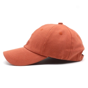 Detail of cotton baseball cap with twill fabric texture and embroidered eyelets