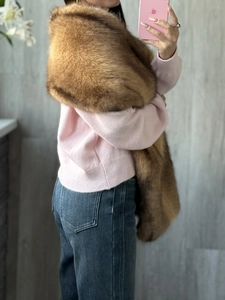 Detailed texture of brown faux fox fur shawl wrap accessory for winter outfits