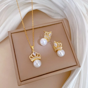 Titanium steel jewelry set featuring a gold crown pearl necklace and matching earrings