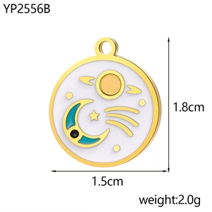 Detail view of round celestial charm with gold sun and moon motifs, size 1.8cm x 1.5cm