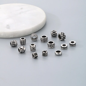 Silver stainless steel cylindrical spacer beads with assorted vintage engraved patterns