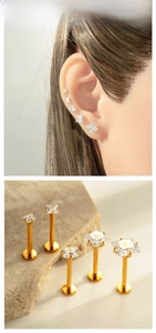 Detail of G23 titanium labret studs with five sizes of square-cut cubic zirconia stones