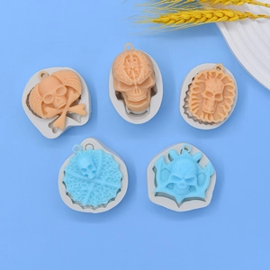 Set of 5 Halloween skull shaped silicone molds for DIY clay and resin crafts on blue background