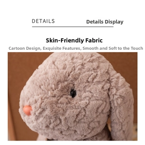 Macro close-up of soft brown plush bunny showing fluffy faux fur and detailed face