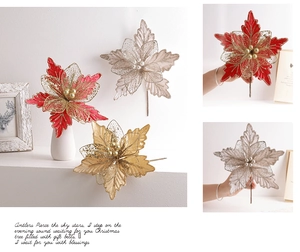 Detail of 24cm glitter poinsettia flowers in red, gold and silver for Christmas trees
