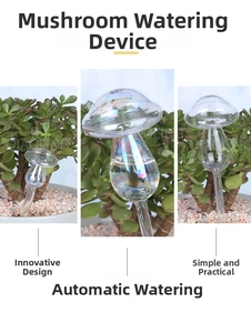 Detail of mushroom-shaped glass self-watering globe inserted in a potted green plant