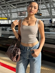 Chic light grey ribbed knit square neck tank top worn with blue jeans and leather handbag
