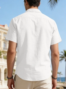 Rear view of a men's white short-sleeve linen shirt with a classic collar and casual fit