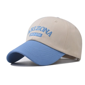 Detailed close-up of Arizona 3D embroidery on two-tone cotton baseball cap with blue brim