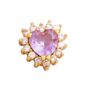 Macro shot of a gold heart charm featuring a purple zircon center and white micro-pave stones