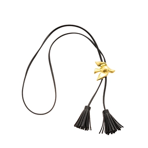 Elegant black leather necklace featuring a gold bird slider and refined tassel pendants