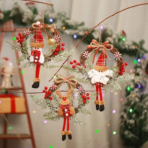 Christmas wreath set with Santa, snowman and reindeer on natural rattan door hangers