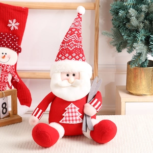 Cute sitting Santa Claus doll with knitted texture and skis for Christmas home decor