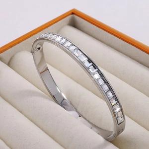 Silver stainless steel bangle bracelet with square clear crystals in a jewelry gift box