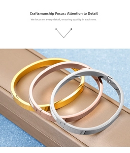 Close-up of gold, rose gold and silver plated stainless steel bangles with brushed finish