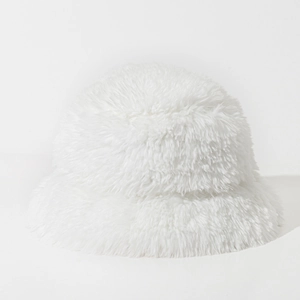 Close-up of soft white faux fur bucket hat material showing fluffy plush texture and warmth