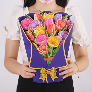 Detail of 3D pop-up tulip flower bouquet card held by a person for Mother's Day