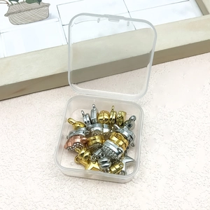 Assorted gold and silver magnetic lobster clasps in a clear storage box for DIY jewelry