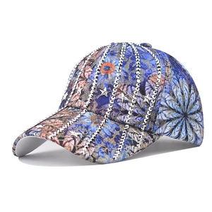Blue floral baseball cap with sparkling rhinestones and silver star metal accents