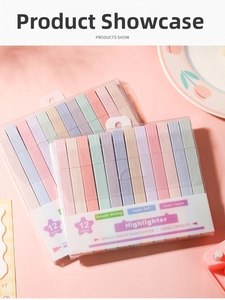 Close-up of 12-piece pastel highlighter set in a transparent box on a pink desk