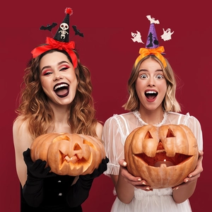 Halloween witch hat headband for kids with festive bow and spooky motifs on red background