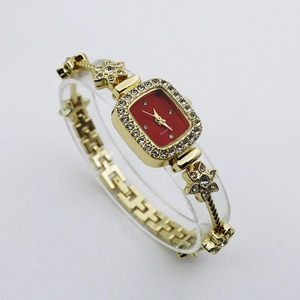Luxurious gold flower bracelet watch with a square red dial and sparkling rhinestone accents
