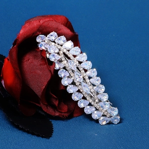 Macro detail of the sparkling pear-shaped zircon stones set in silver metal floral hair clip