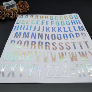 Close-up of laser holographic alphabet stickers with vibrant rainbow iridescent finish
