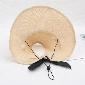 Women's summer straw open top sun hat with wide brim and black bow detail and wind rope