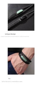 Detail of woven black leather bracelet with natural aventurine stone on male wrist