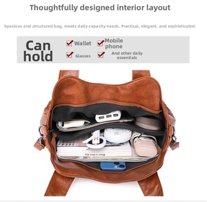 Interior view showing large capacity and multi-layer compartments of brown tote bag