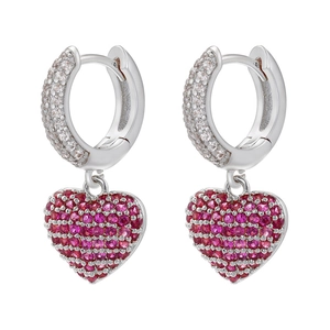 Detail of silver heart drop earrings featuring micro-pave pink gemstones and white zircons