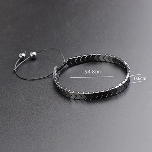 Macro shot of black hematite heart bracelet with adjustable size and matte texture