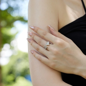 Detail view of S925 silver open ring featuring sparkling heart and square zircon stones