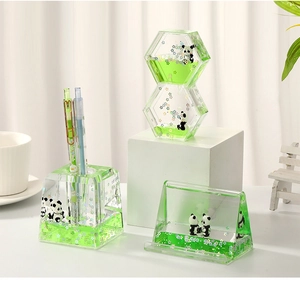 Detail of panda liquid desk set with acrylic pen holder and phone stand in green