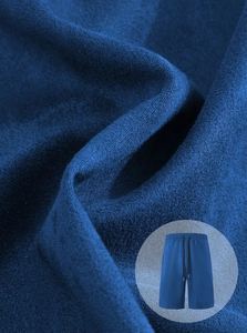 Detail view of navy blue drawstring shorts showing soft knit fabric texture and quality