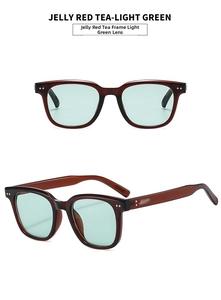 Detail view of jelly red tea frame sunglasses with light green lenses and rivets
