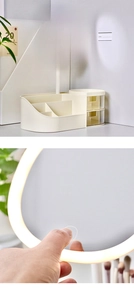 Detail of beige makeup organizer featuring a touch-sensitive LED mirror and drawers