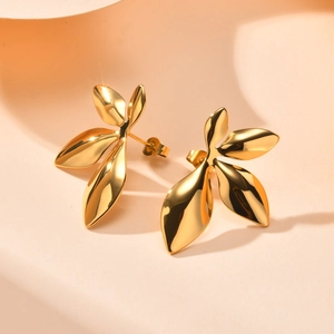 Elegant 18K gold-plated leaf stud earrings for women featuring a smooth metallic finish